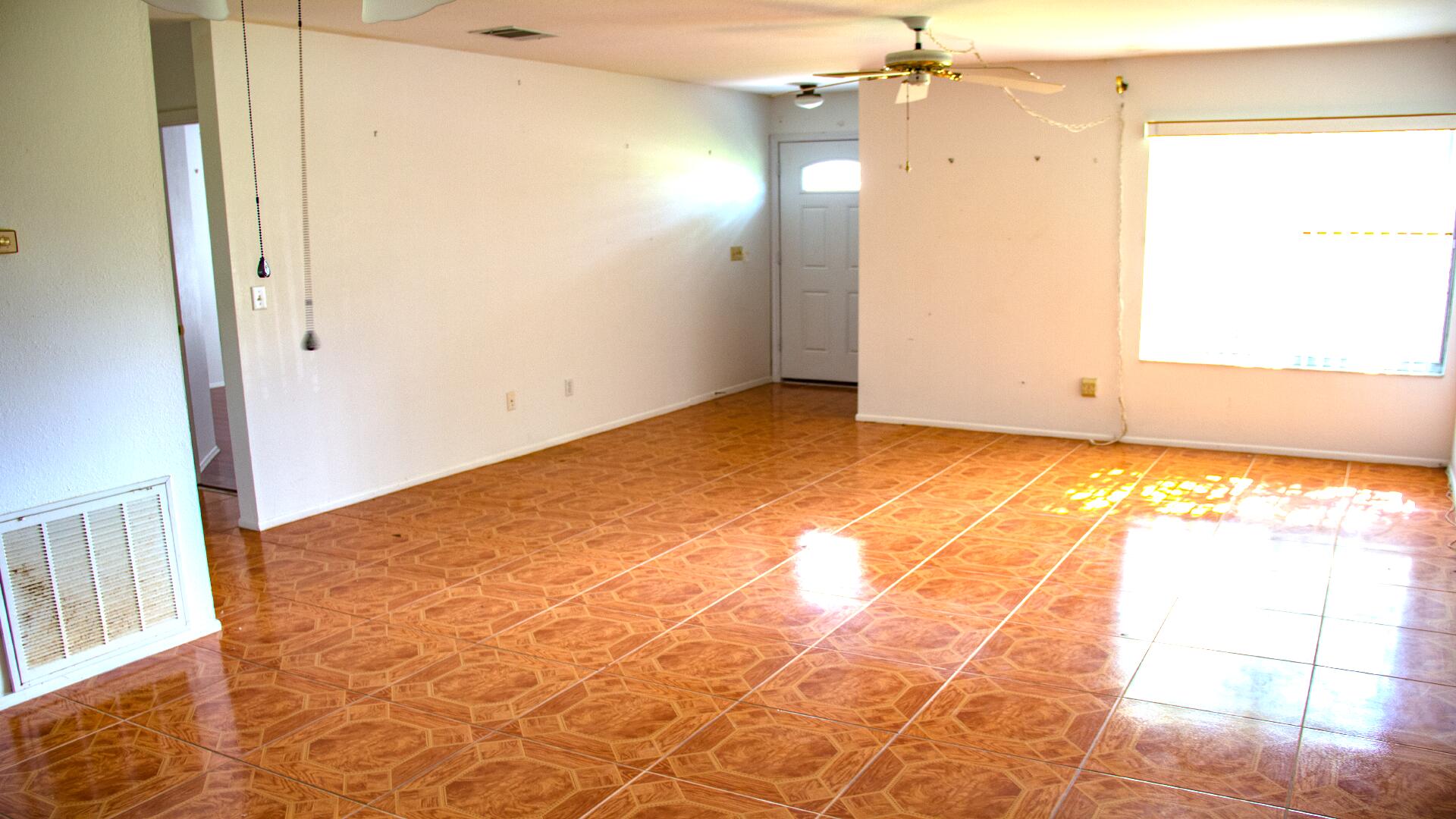 411 Southwest Ruffner Court Port St. Lucie, FL 34953 - Photo 13 of 28 Living room facing front door