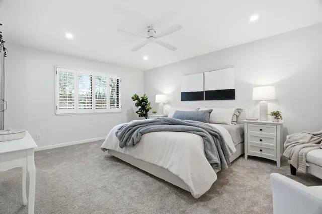 a bedroom with bed and window
