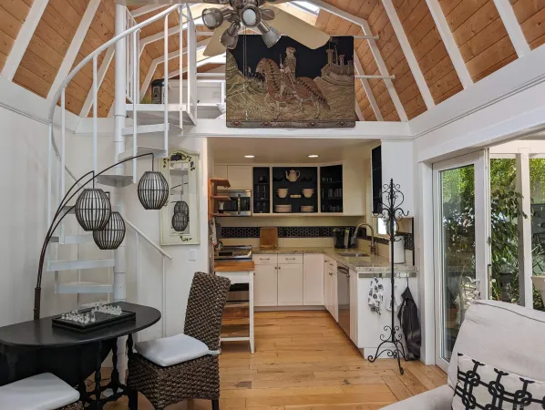 a kitchen with stainless steel appliances kitchen island granite countertop a stove a sink and a microwave