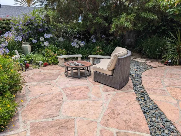 a view of backyard with a table and chairs