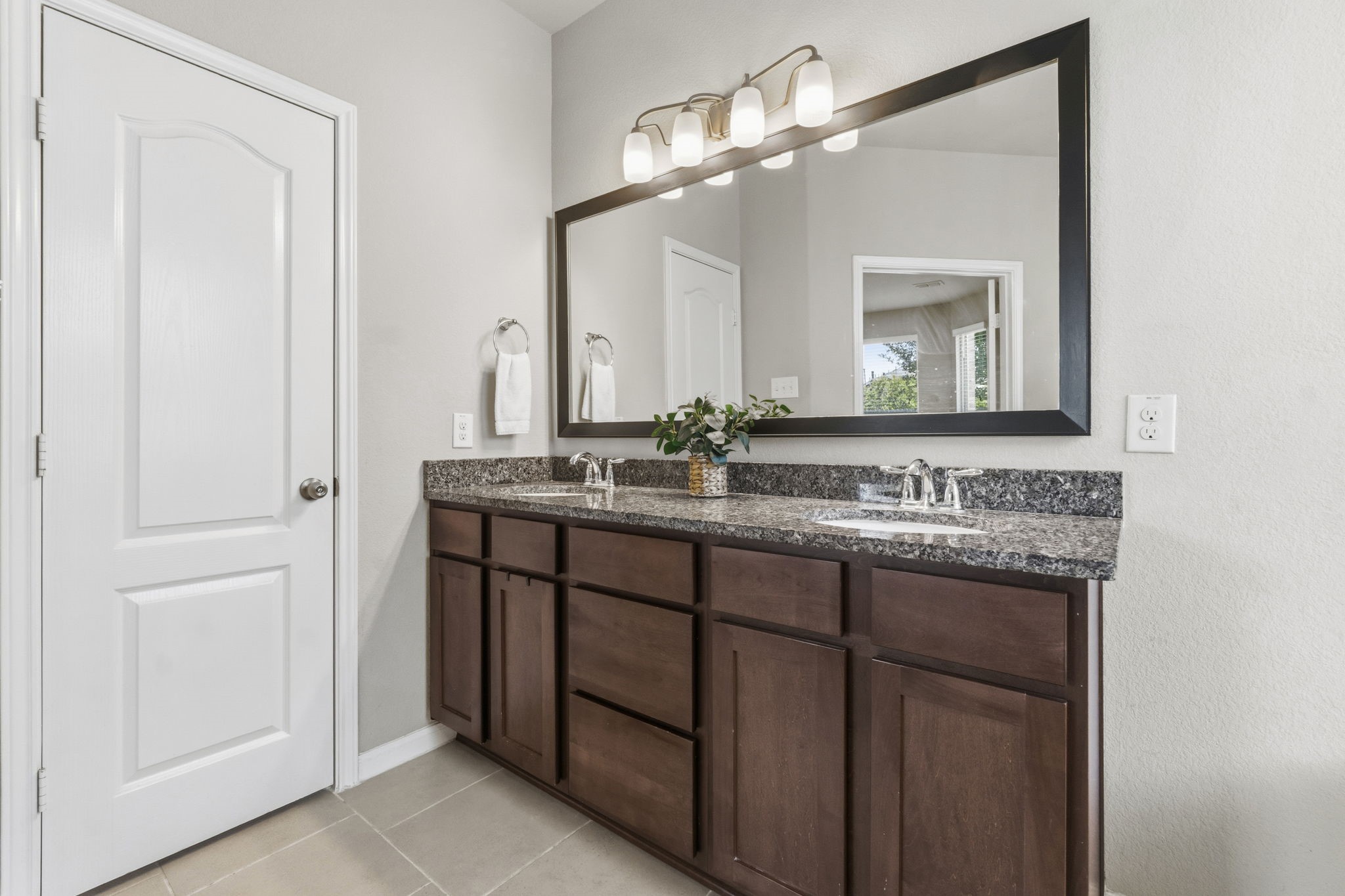 3900 Enchanted Timbers Lane Spring, TX 77386 - Photo 23 of 49 a bathroom with a double vanity sink and a mirror