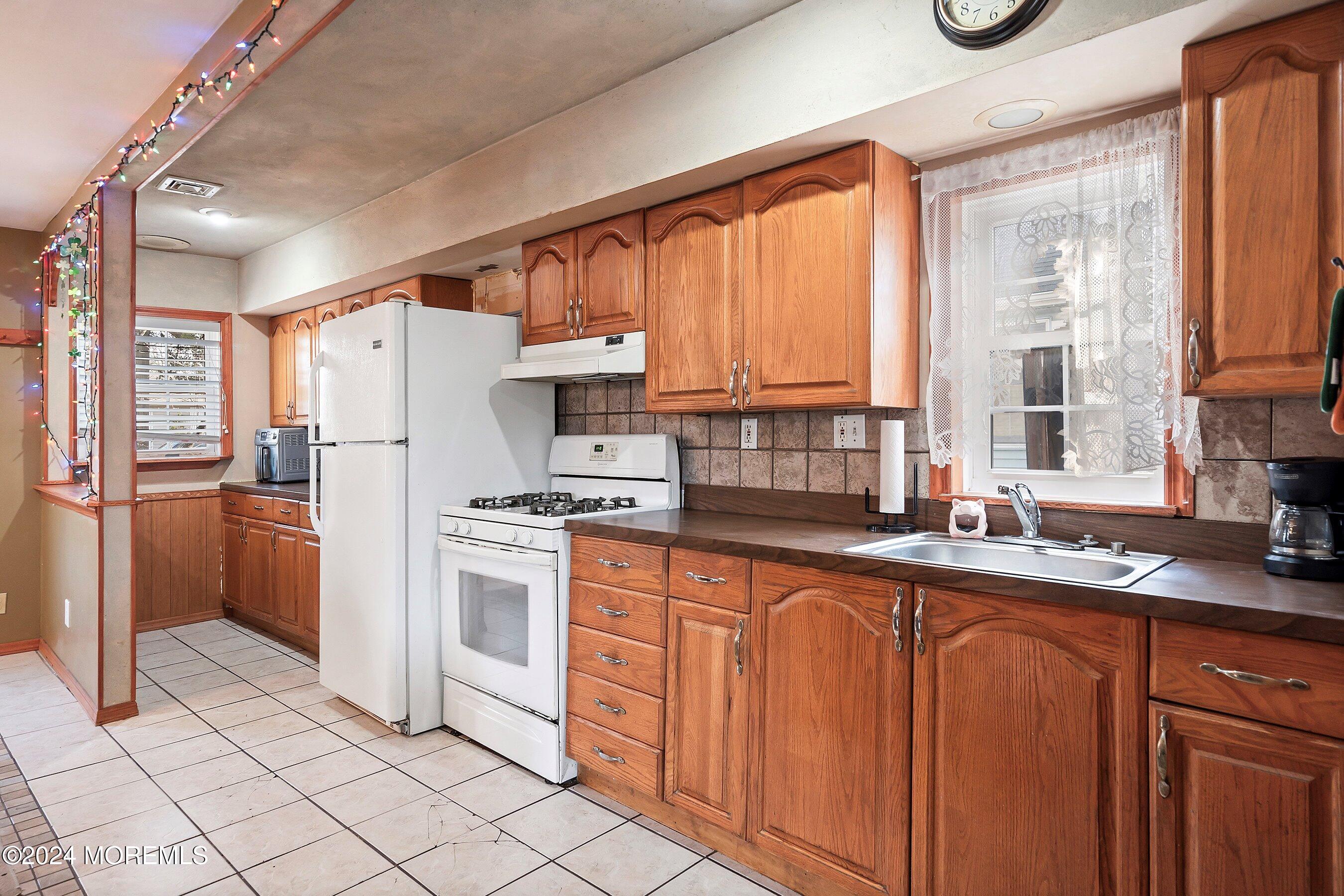 170 Cherry Quay Road Brick, NJ 08723 - Photo 13 of 28 a kitchen with stainless steel appliances granite countertop a refrigerator and a sink