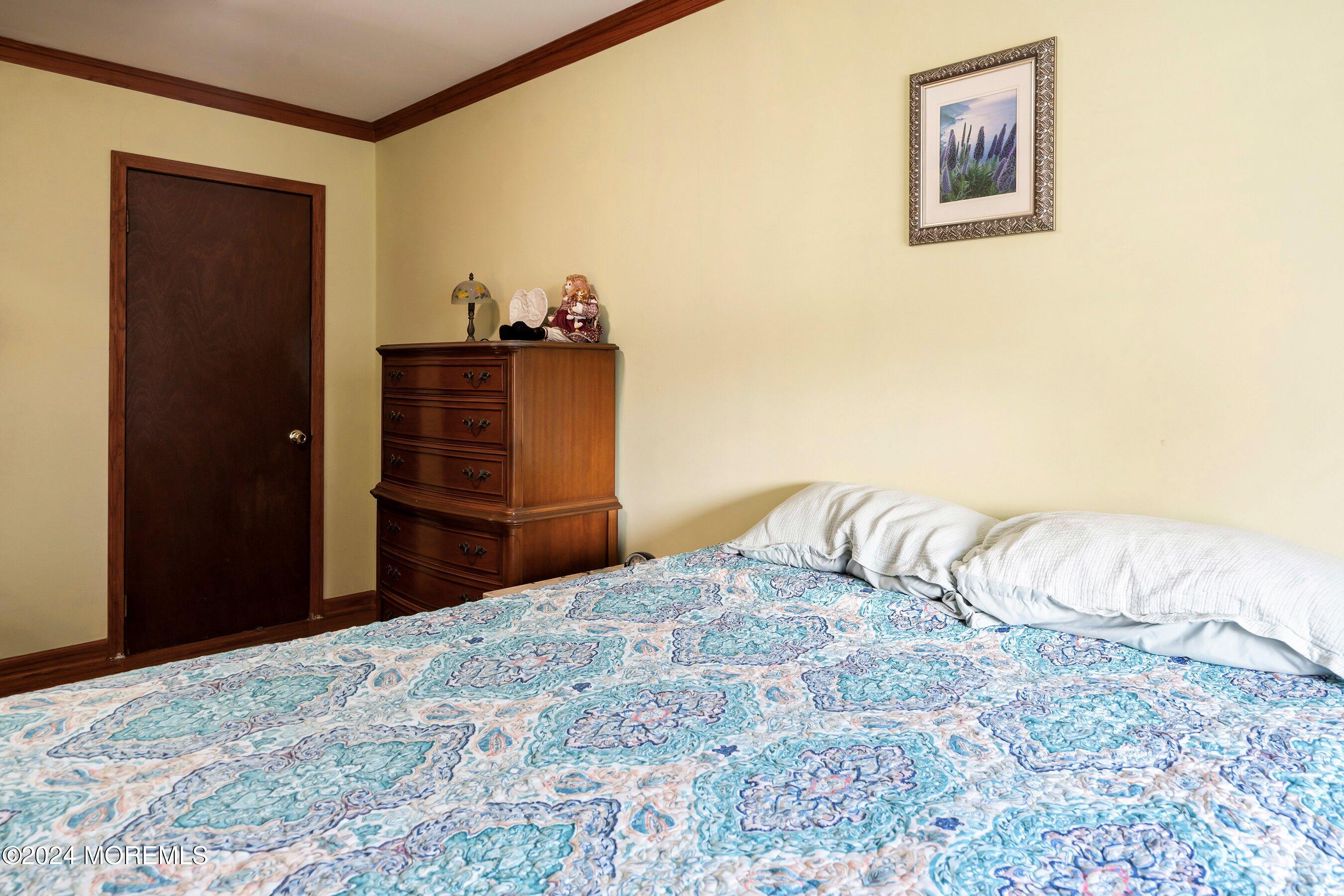 170 Cherry Quay Road Brick, NJ 08723 - Photo 15 of 28 a bedroom with a bed and a dresser