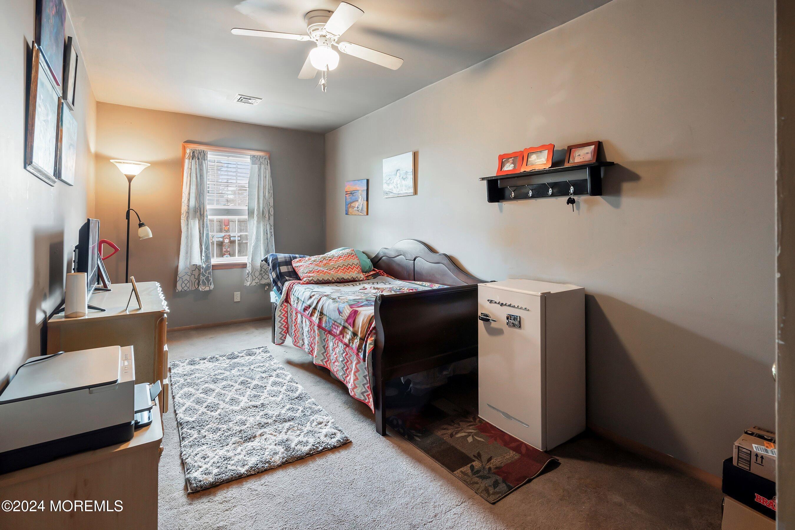 170 Cherry Quay Road Brick, NJ 08723 - Photo 17 of 28 a bedroom with furniture and a flat screen tv