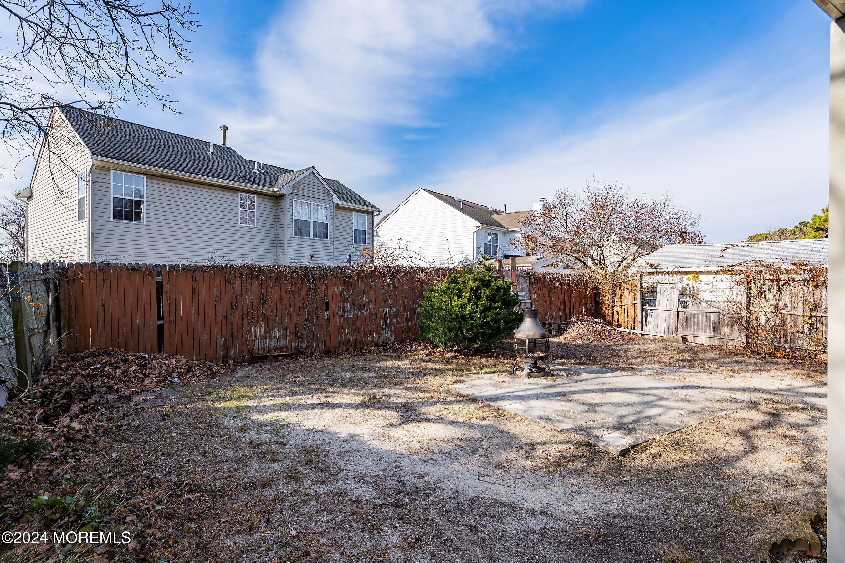 170 Cherry Quay Road Brick, NJ 08723 - Photo 20 of 28 a view of a backyard of a house