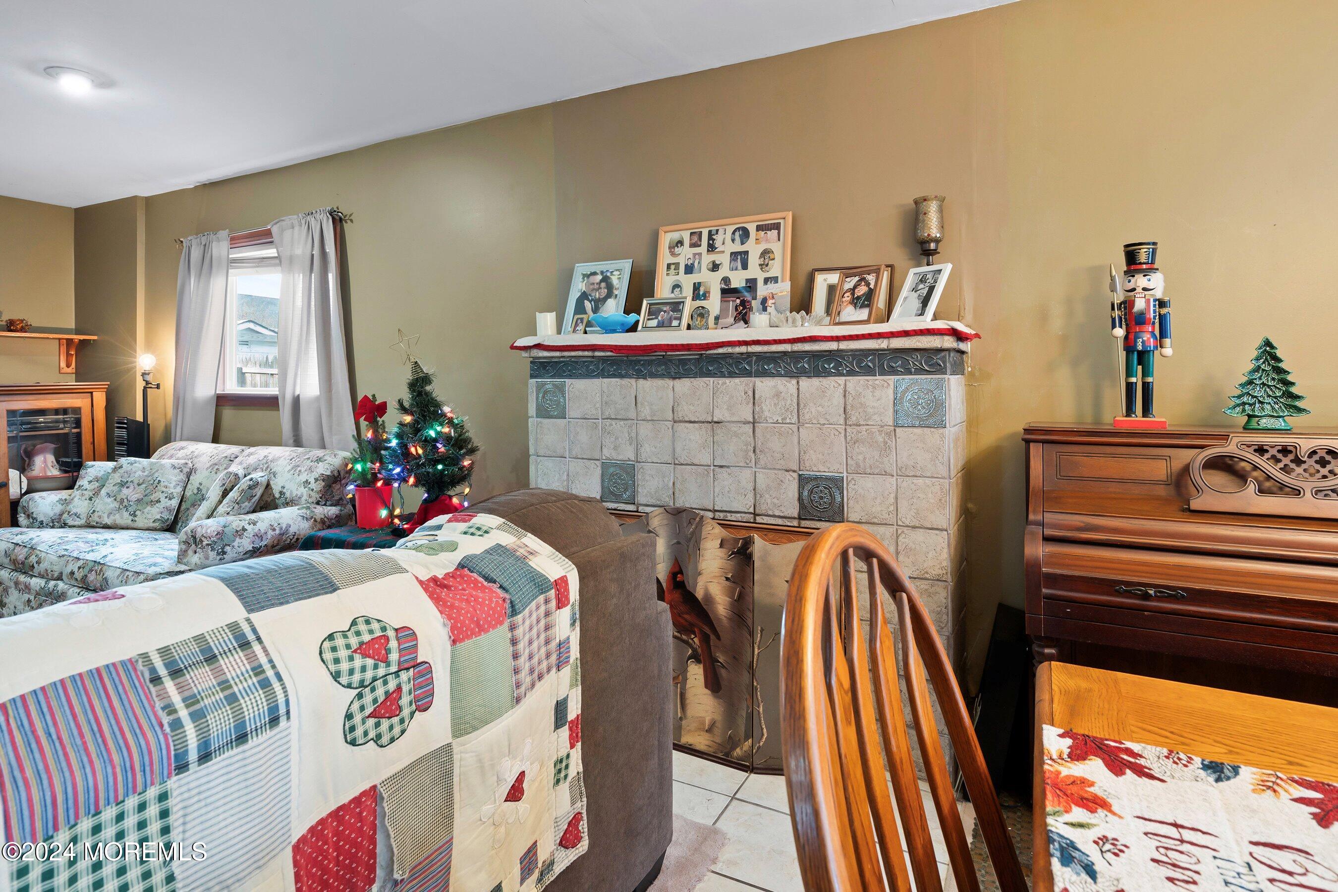 170 Cherry Quay Road Brick, NJ 08723 - Photo 8 of 28 a bedroom with furniture and a fireplace