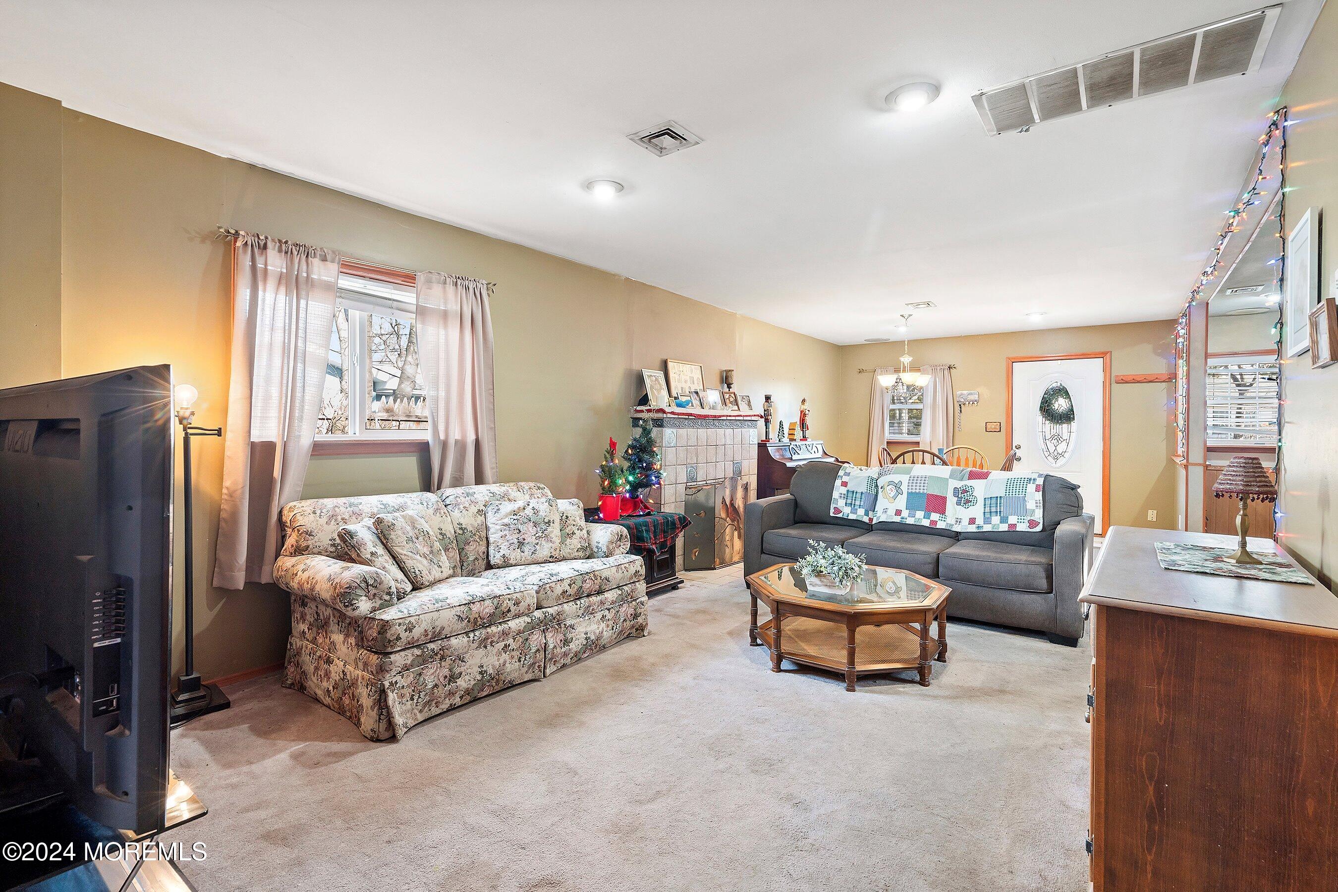 170 Cherry Quay Road Brick, NJ 08723 - Photo 10 of 28 a living room with furniture and a flat screen tv