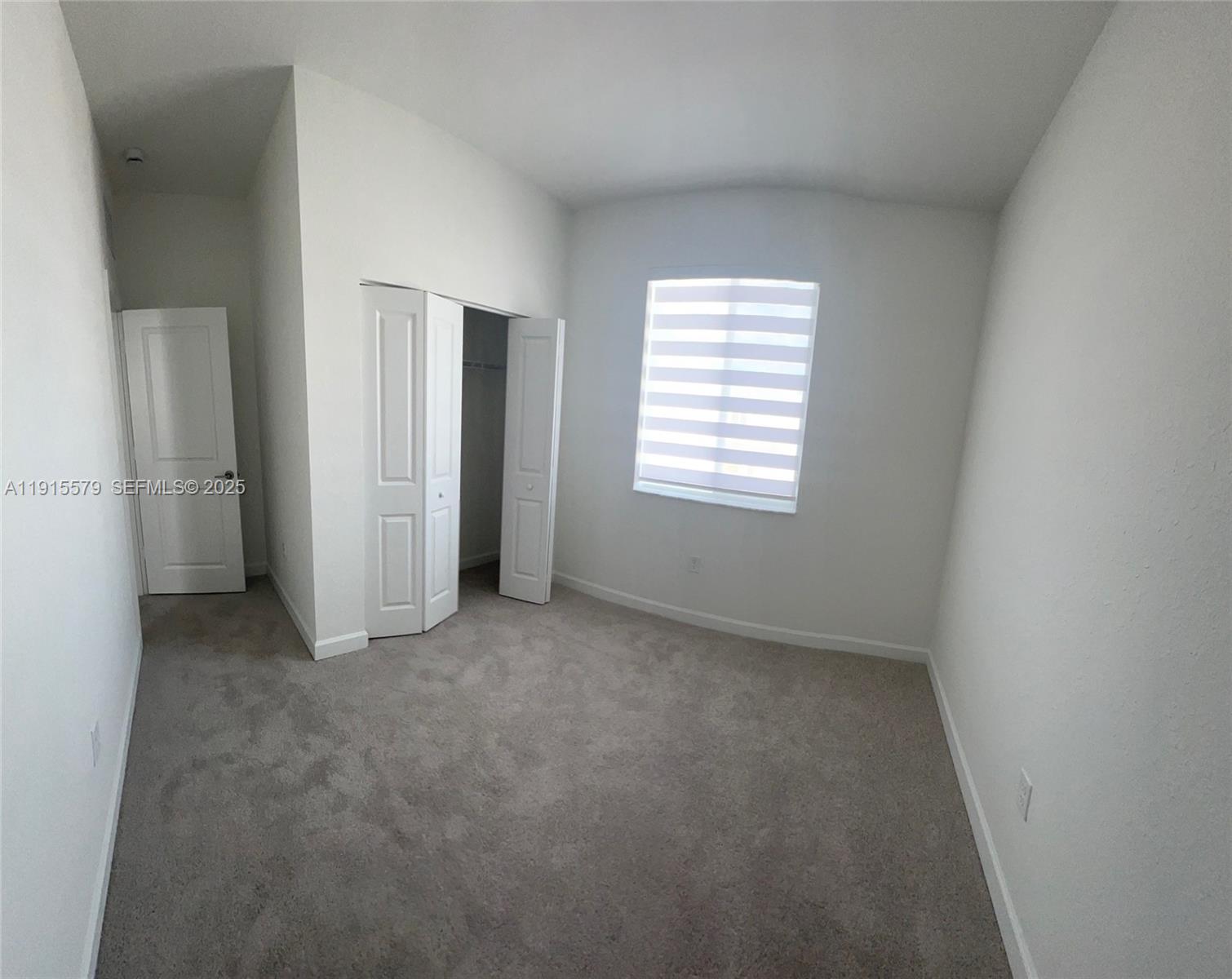 1455 Southeast 6th Terrace Homestead, FL 33034 - Photo 12 of 16 an empty room with windows