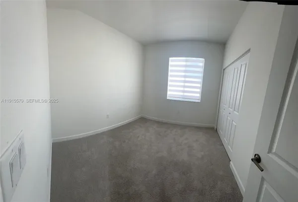 a bathroom with a tub a sink and a large mirror