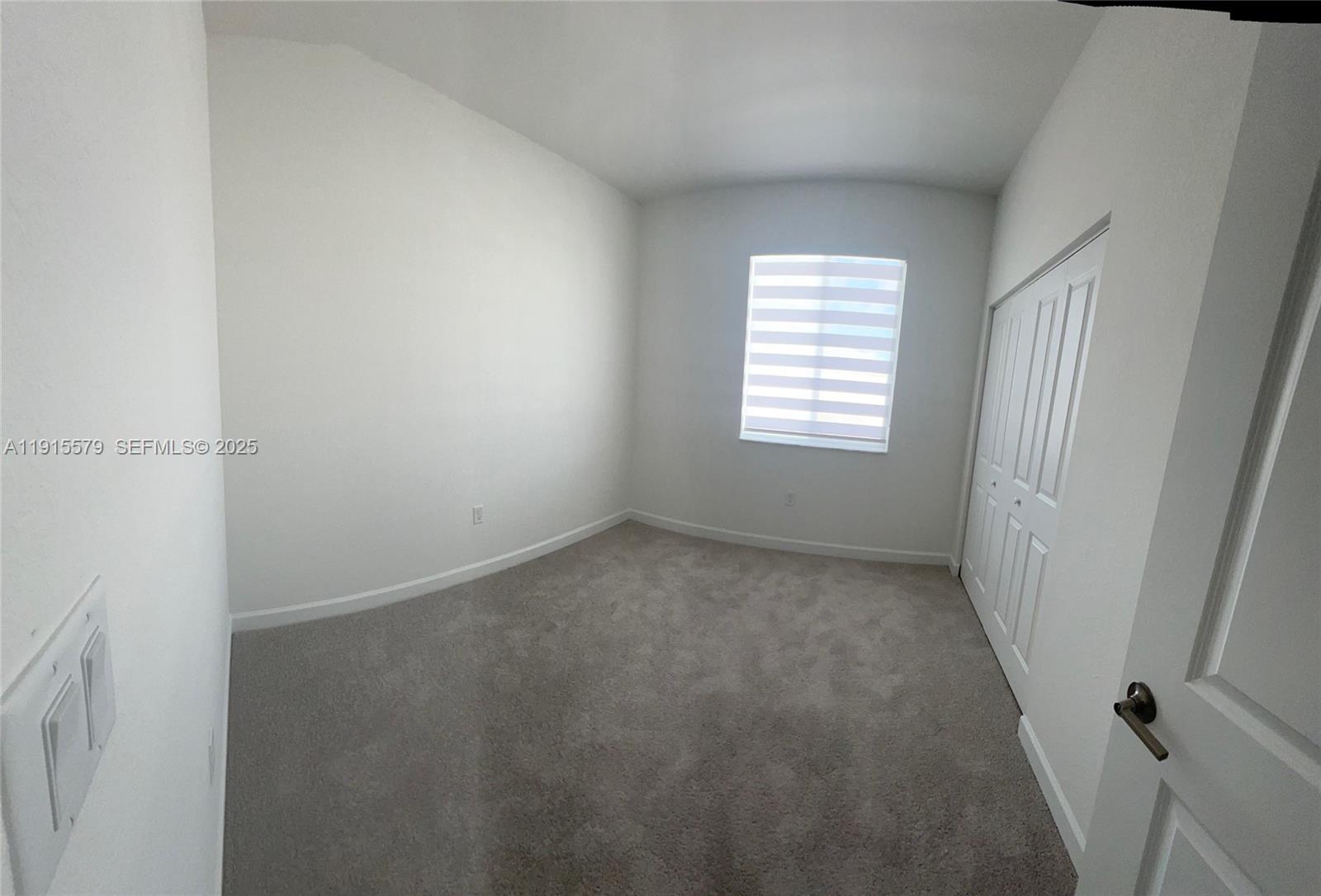 1455 Southeast 6th Terrace Homestead, FL 33034 - Photo 13 of 16 an empty room with windows