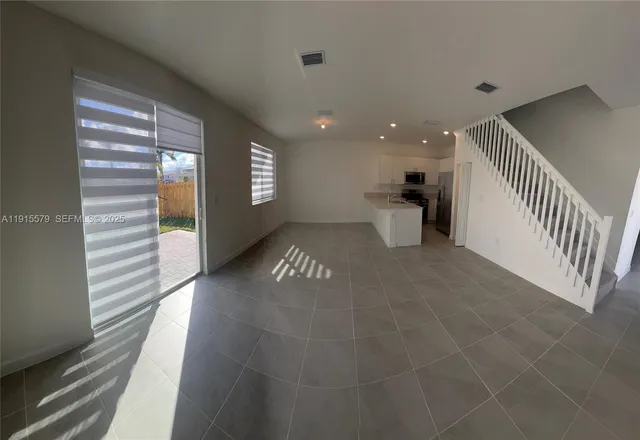 a view of a hallway with wooden shelves