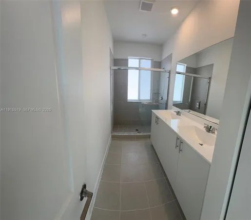 a view of a balcony with wooden floor and fence