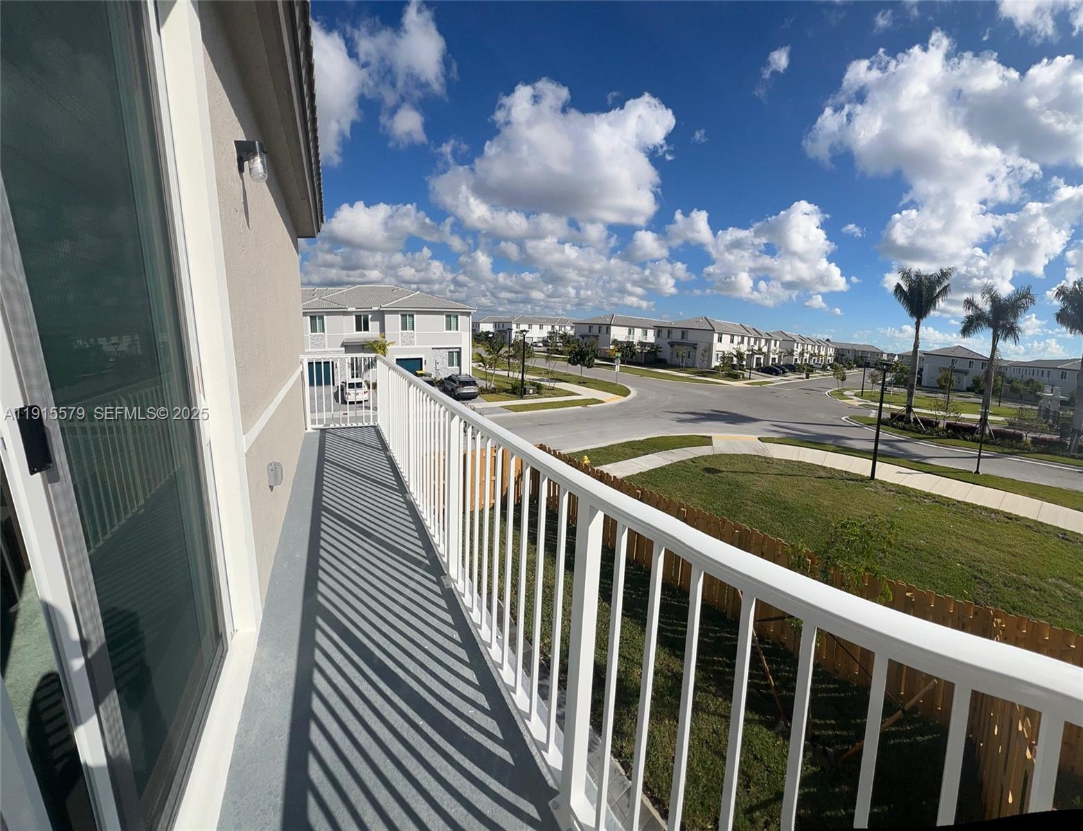 1455 Southeast 6th Terrace Homestead, FL 33034 - Photo 9 of 16 a view of a balcony with wooden floor and fence