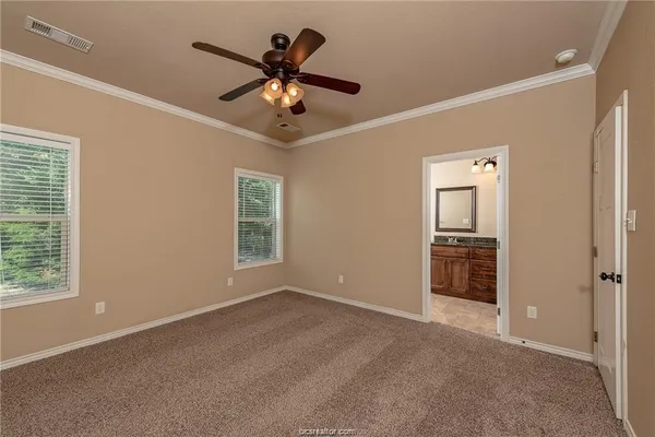 a view of a livingroom with a ceiling fan and window