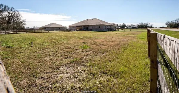 a view of a lake with a house in the background