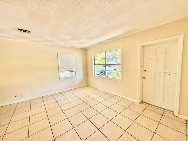 a view of an empty room and window