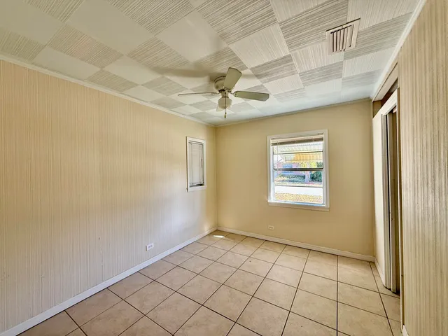 a view of an empty room and a window