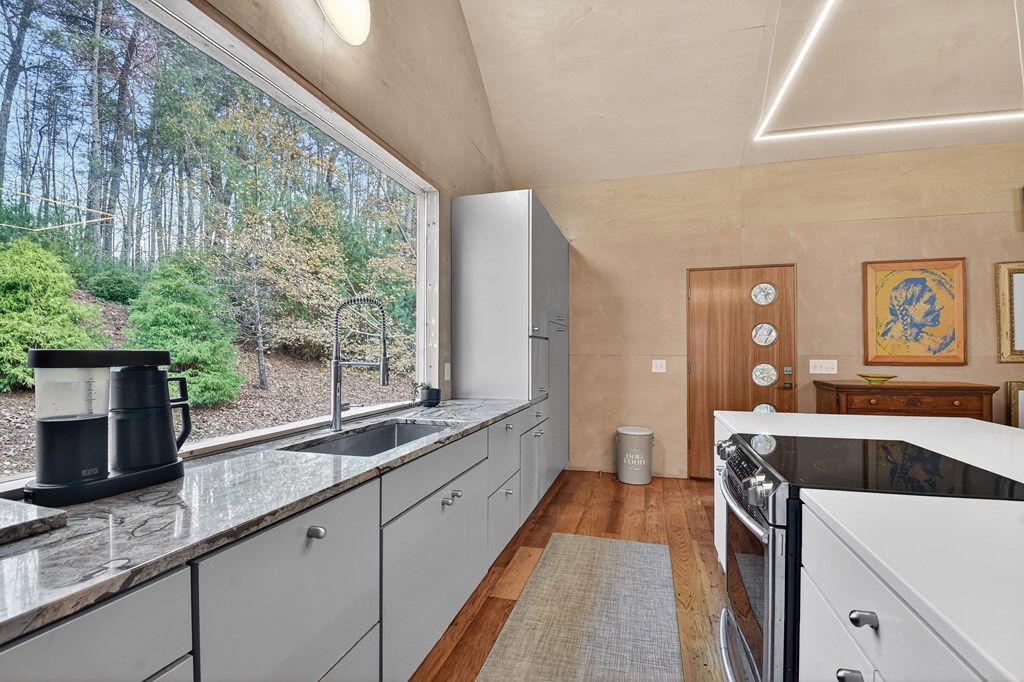 175 Big Creek Road Cherry Log, GA 30522 - Photo 19 of 40 a view of a kitchen with a sink and wooden floor