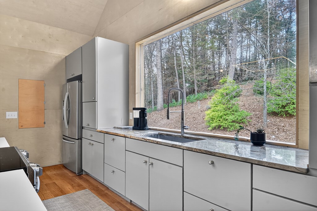 175 Big Creek Road Cherry Log, GA 30522 - Photo 20 of 40 a kitchen with a sink and large window