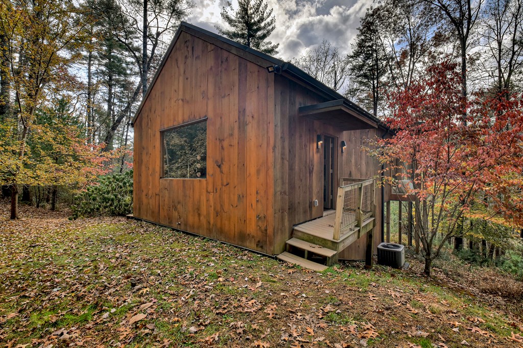 175 Big Creek Road Cherry Log, GA 30522 - Photo 23 of 40 a view of backyard with a small cabin and a chair