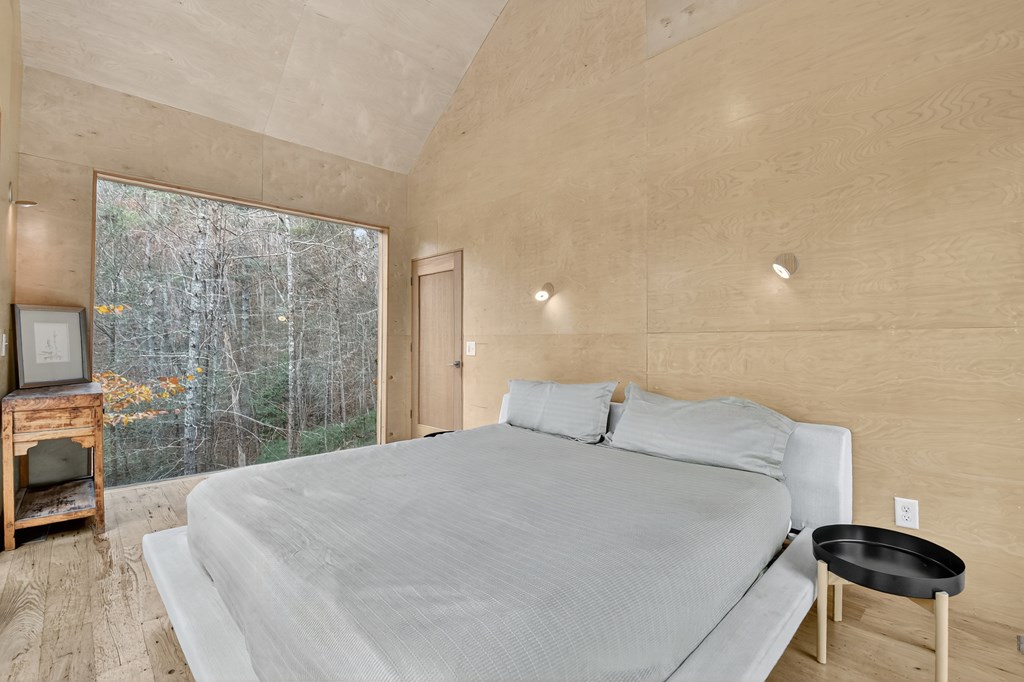 175 Big Creek Road Cherry Log, GA 30522 - Photo 31 of 40 a bedroom with a bed and a television