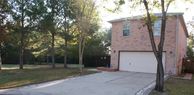 a house view with a backyard space