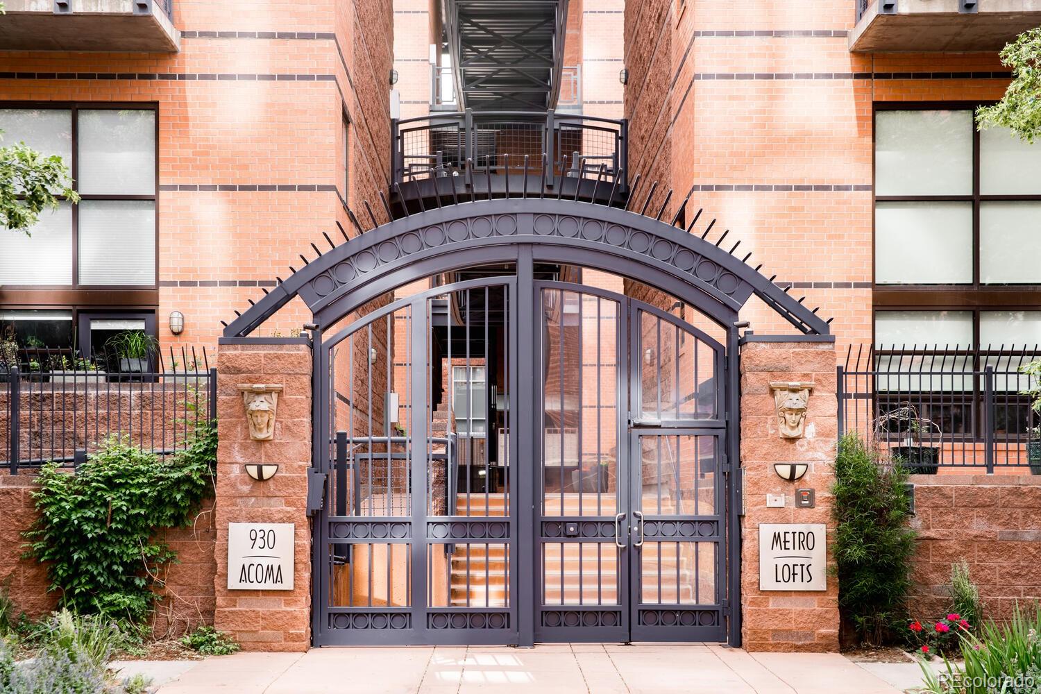 930 Acoma Street, Unit 212 Denver, CO 80204 - Photo 1 of 35 a front view of a building with a street