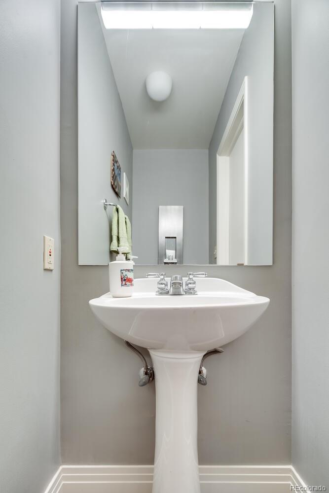 930 Acoma Street, Unit 212 Denver, CO 80204 - Photo 17 of 35 a bathroom with a sink and a mirror