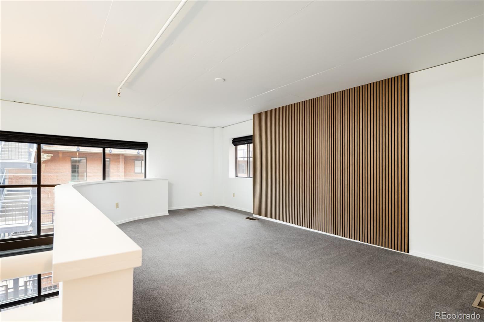 930 Acoma Street, Unit 212 Denver, CO 80204 - Photo 20 of 35 an empty room with windows