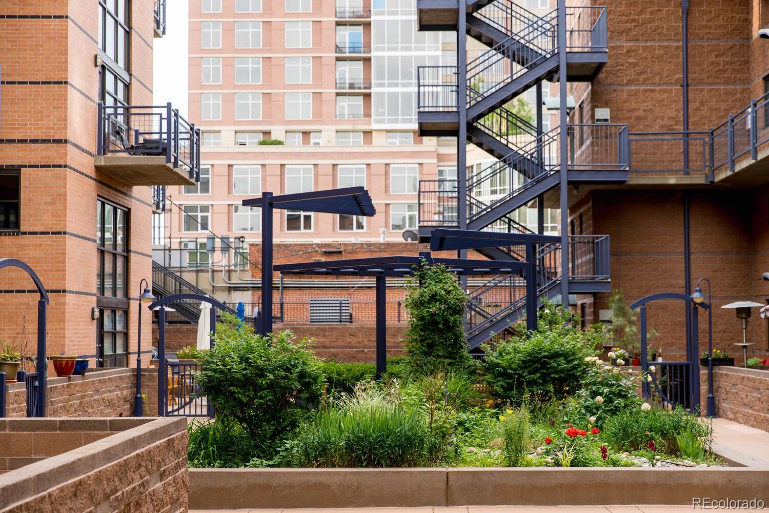 930 Acoma Street, Unit 212 Denver, CO 80204 - Photo 2 of 35 a view of building along with street