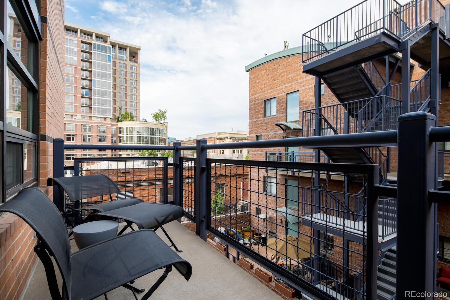 930 Acoma Street, Unit 212 Denver, CO 80204 - Photo 29 of 35 a view of a balcony with chairs