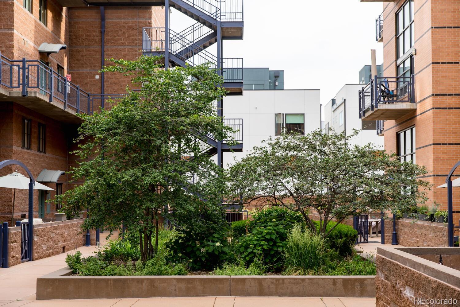 930 Acoma Street, Unit 212 Denver, CO 80204 - Photo 32 of 35 a view of a city with tall buildings