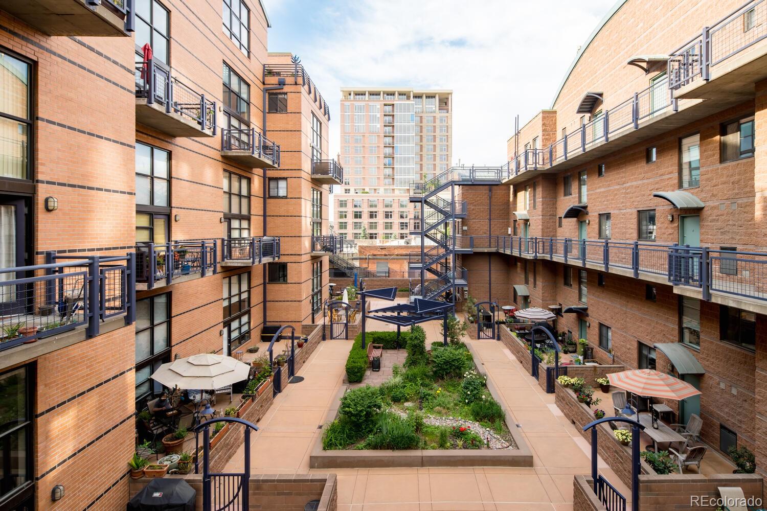 930 Acoma Street, Unit 212 Denver, CO 80204 - Photo 33 of 35 a view of a chairs and table in the balcony