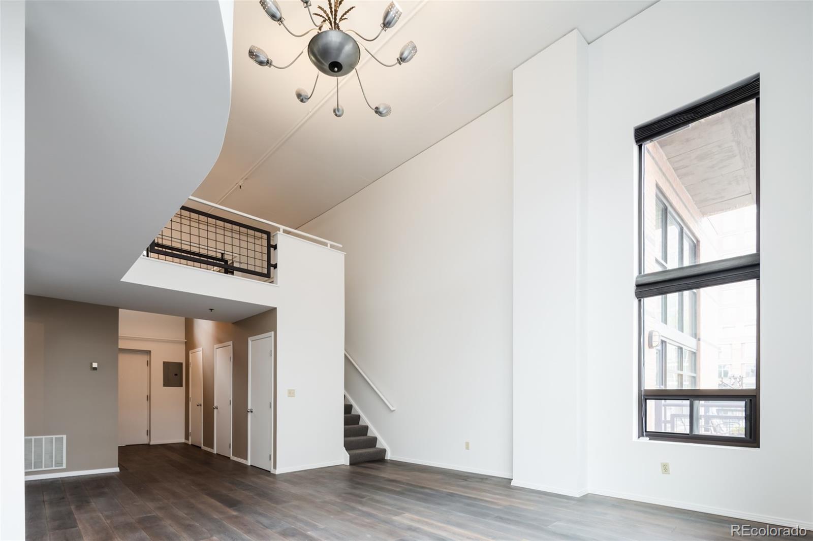 930 Acoma Street, Unit 212 Denver, CO 80204 - Photo 7 of 35 a view of an entryway with wooden floor