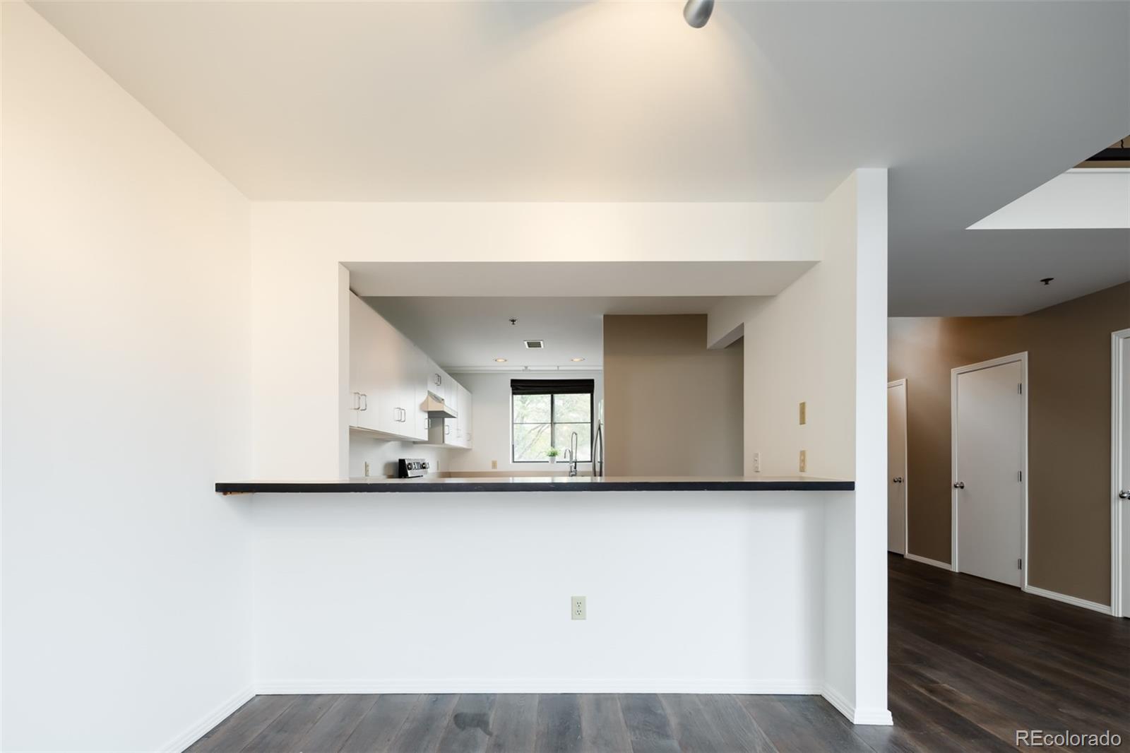 930 Acoma Street, Unit 212 Denver, CO 80204 - Photo 10 of 35 a view of a car garage door