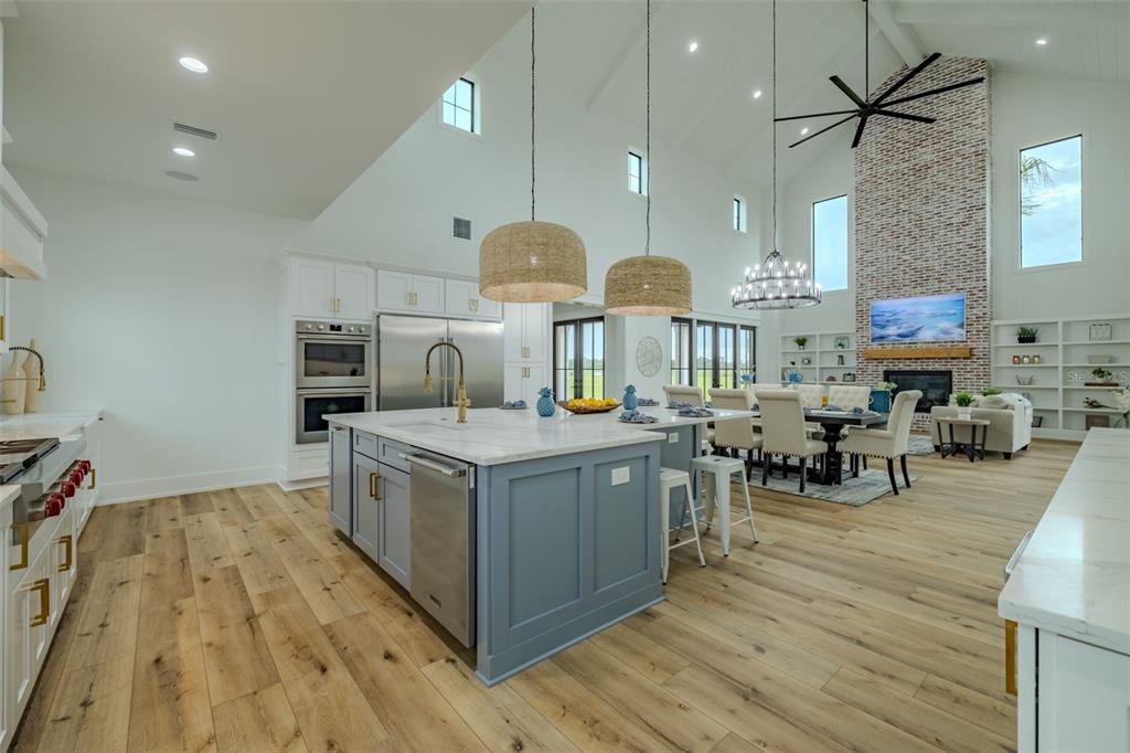 3515 Powerline Road Lithia, FL 33547 - Photo 22 of 100 a kitchen with stainless steel appliances granite countertop a stove and a wooden floors