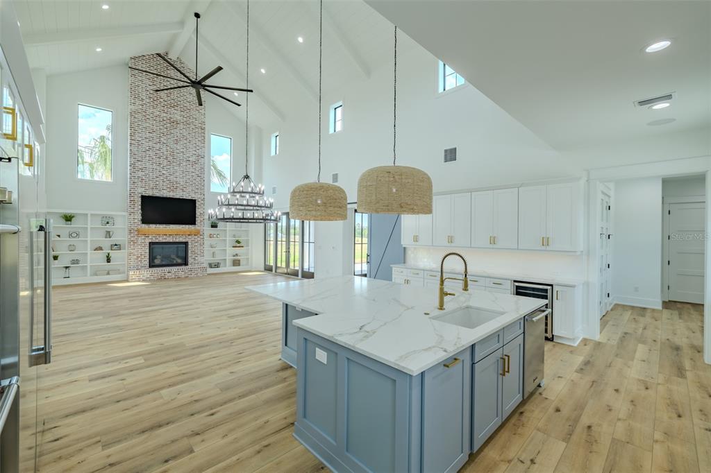 3515 Powerline Road Lithia, FL 33547 - Photo 30 of 100 a kitchen with a sink stove and wooden floor
