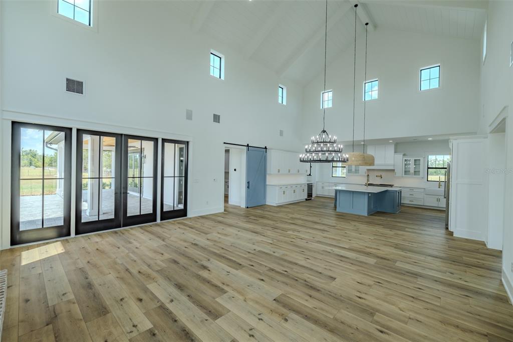 3515 Powerline Road Lithia, FL 33547 - Photo 37 of 100 a view of kitchen and hall with wooden floor
