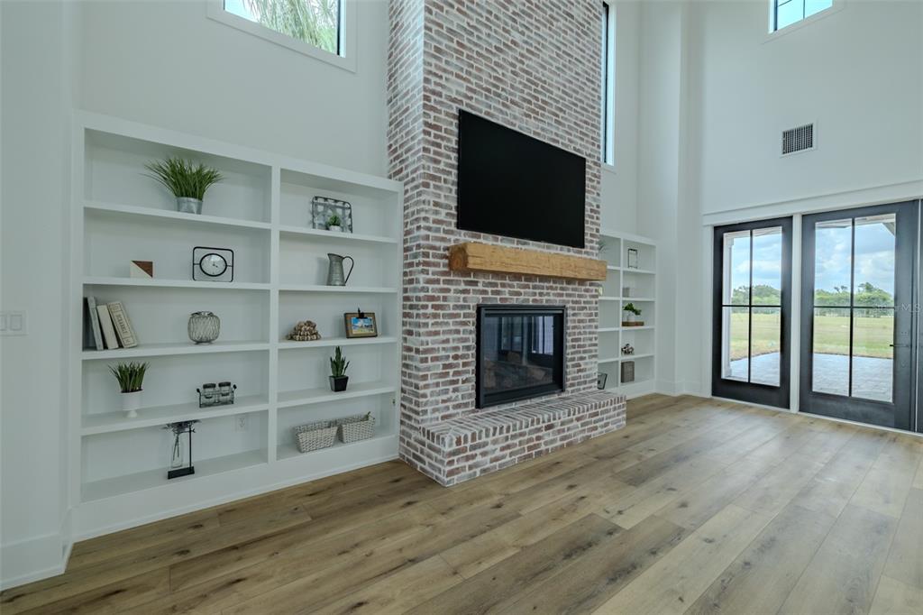 3515 Powerline Road Lithia, FL 33547 - Photo 39 of 100 a view of an empty room with a fireplace and a window
