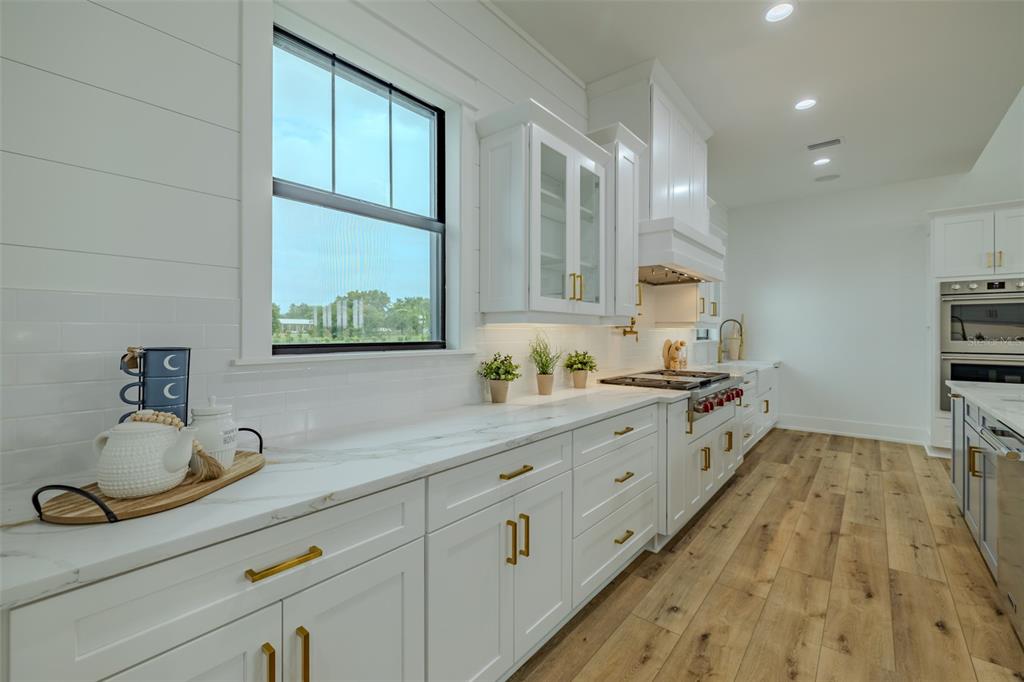 3515 Powerline Road Lithia, FL 33547 - Photo 49 of 100 a spacious bathroom with a double vanity sink and a window
