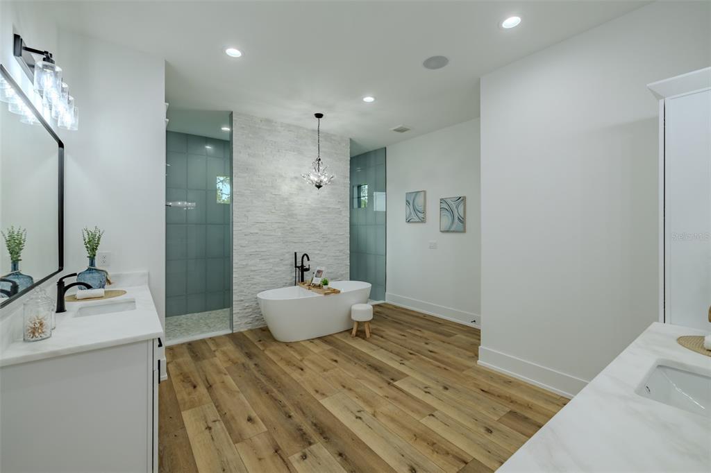 3515 Powerline Road Lithia, FL 33547 - Photo 52 of 100 a bathroom with a sink and mirror