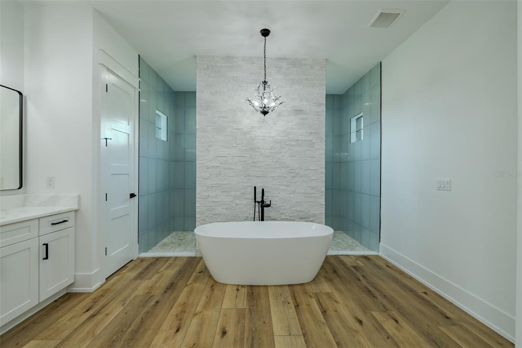 3515 Powerline Road Lithia, FL 33547 - Photo 54 of 100 a bathroom with a sink and a mirror