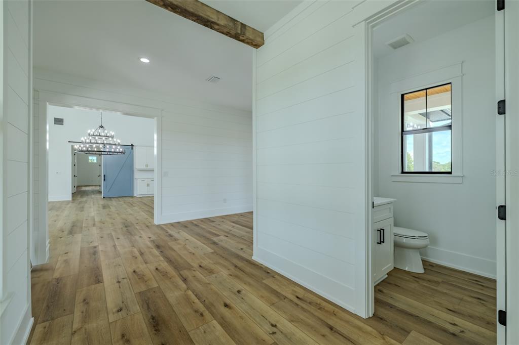 3515 Powerline Road Lithia, FL 33547 - Photo 75 of 100 a view of a bathroom with wooden floor and a sink