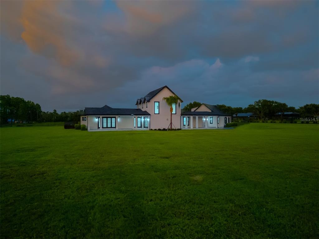 3515 Powerline Road Lithia, FL 33547 - Photo 98 of 100 a view of a green field in front of a house