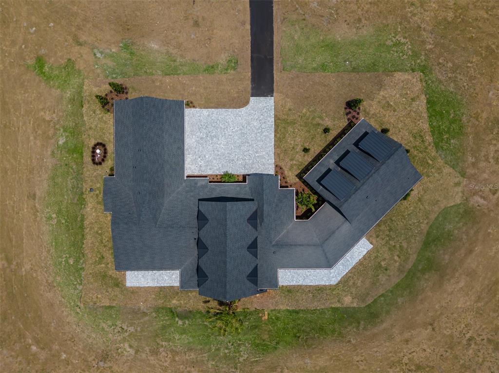 3515 Powerline Road Lithia, FL 33547 - Photo 99 of 100 an aerial view of a house with a yard