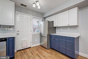 2002 E Street Northeast Washington, DC 20002 - Photo 4 of 13 a kitchen with stainless steel appliances granite countertop a refrigerator and a stove top oven