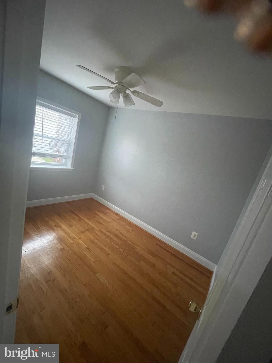 2002 E Street Northeast Washington, DC 20002 - Photo 8 of 13 en empty room with windows and ceiling fan view