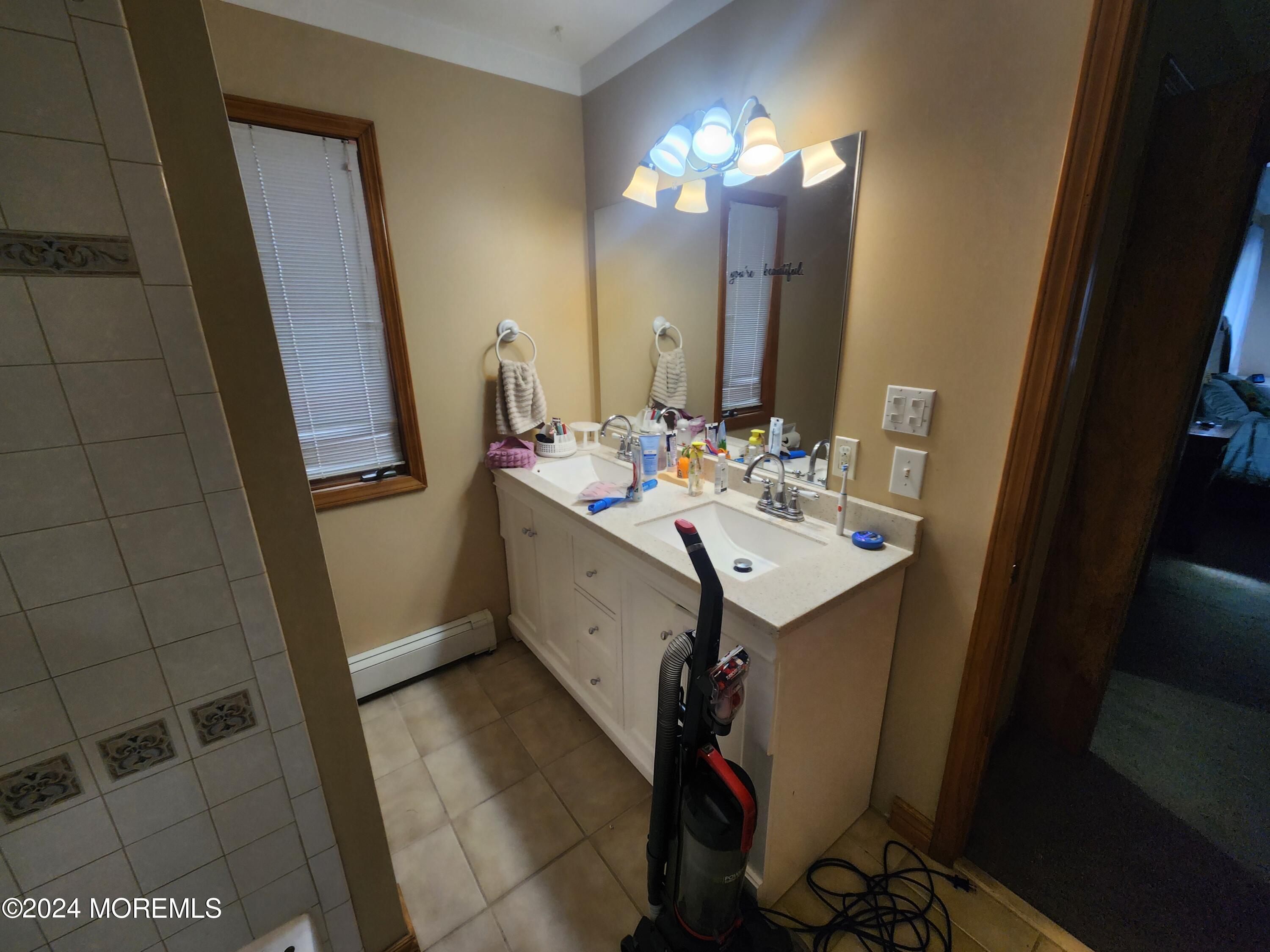 1850 Lakeside Drive South Forked River, NJ 08731 - Photo 17 of 54 a bathroom with a sink vanity and mirror