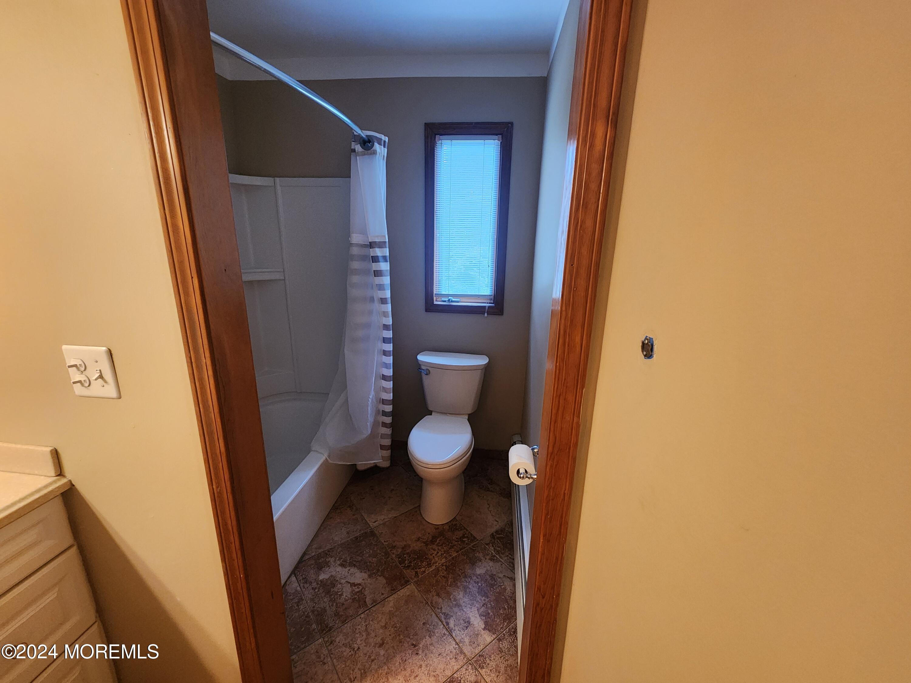 1850 Lakeside Drive South Forked River, NJ 08731 - Photo 36 of 54 a bathroom with a granite countertop toilet and a sink