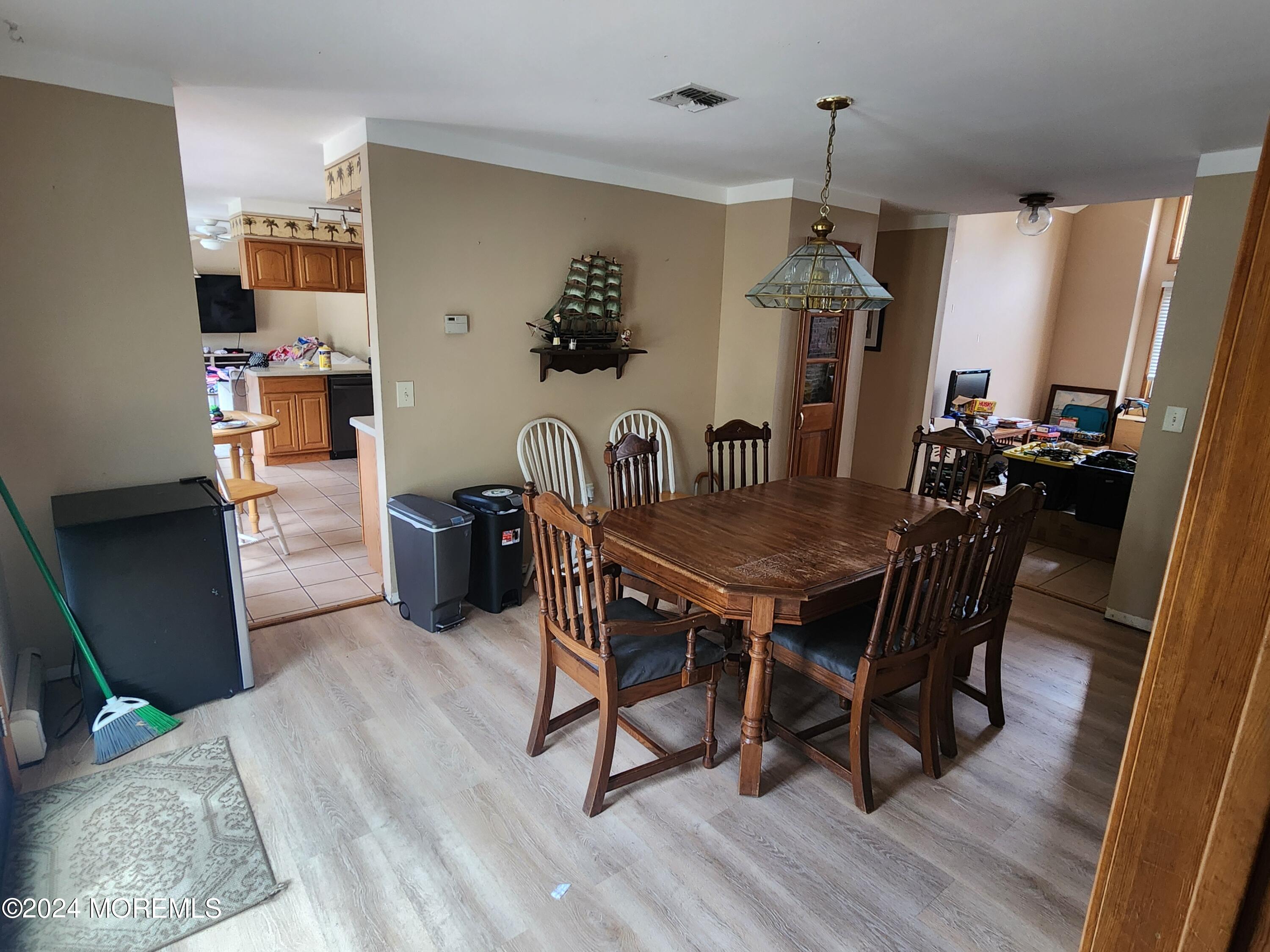 1850 Lakeside Drive South Forked River, NJ 08731 - Photo 38 of 54 a dining room with furniture and wooden floor